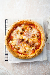 Traditional homemade pizza with ham and cheese