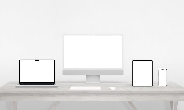 Responsive devices display on a work desk – computer, phone, tablet, laptop. Isolated screens ideal for mockups, showcasing app or web page presentations with versatility in design