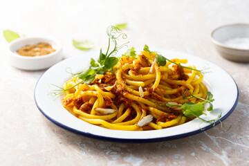 Pasta with red pesto and almond