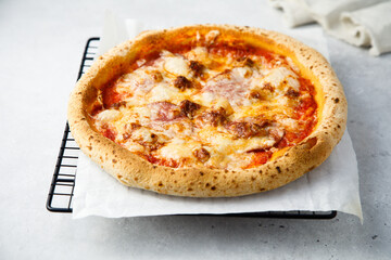 Traditional homemade pizza with ham and cheese