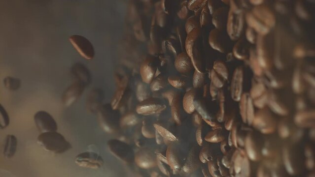 Super slow motion shot of falling roasted coffee beans with smoke in macro. Vertical close up video