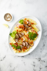 Couscous salad with lamb and chickpeas
