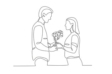 A woman is given flowers by her boyfriend