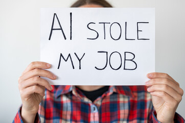 Anonymous person holding sign with inscription 