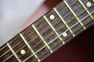 close up of a acoustic guitar neck