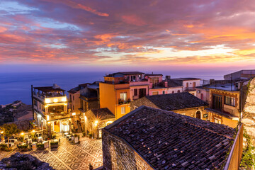 amazing evening view from mountain town to beautiful italian town with roofs and biuldings and...