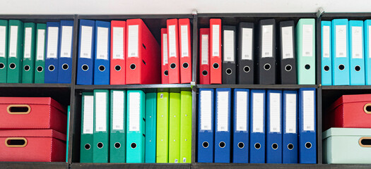 Colourful office folders on the shelf