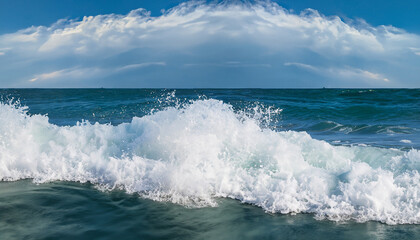 Fototapeta premium Powerful foamy sea waves rolling and splashing over water surface against cloudy blue sky, panoramic image with copy space