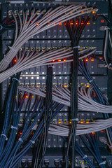 Back side of network servers in the rack with cable connections.