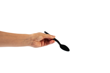 Black plastic spoon in hand on transparent background