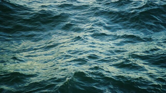 Ocean waves crash at sea