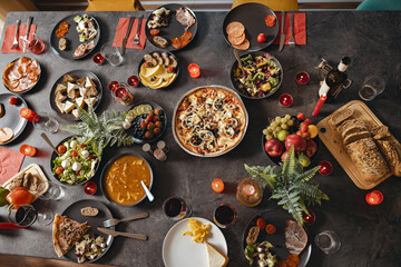 Top view of brunch table with tasty delicious food and beverages ready for holiday home dinner