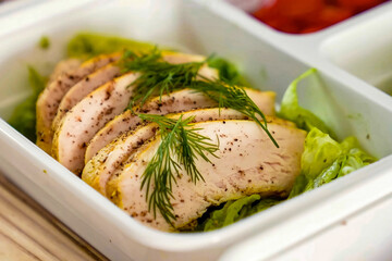 Healthy balanced diet delicious lunch box with vegetables, chicken. Homemade take away box with chicken for deliver ready meal, advert or package, close up selective focus