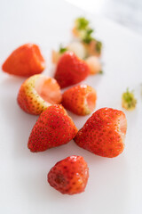 Fresh Strawberries Displayed on a White Cutting Board