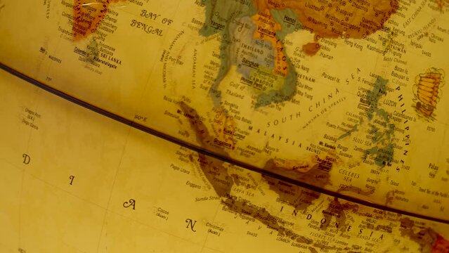 Close up of a classic map showcasing Southeast Asia and surrounding waters