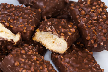 Cookies with rice balls and milk chocolate coating close-up