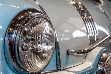 retro car headlight close up