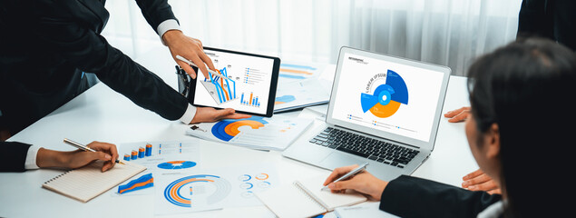Business data dashboard analysis by computer software . Investment application display business sales and profit on the computer screen and advise marketing planning decision oratory . - obrazy, fototapety, plakaty