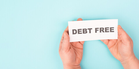Debt free in process, ending credit payments and bank loans, financial freedom, message on paper
