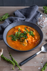 Vegetable soup with tomatoes served on plate