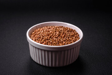 Large grains of raw buckwheat porridge are brown in color