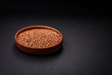 Large grains of raw buckwheat porridge are brown in color