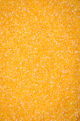 Corn grains or particles are yellow in color when raw
