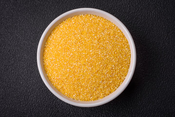 Corn grains or particles are yellow in color when raw