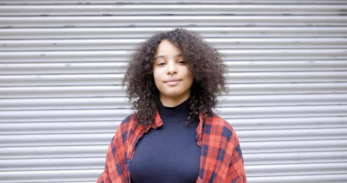 Confident young woman smiling at camera