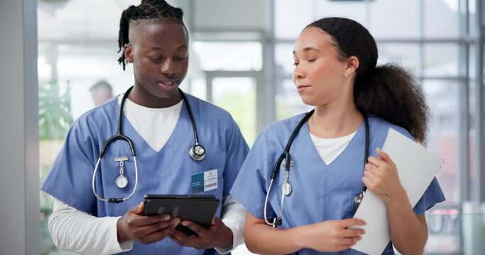 Tablet, doctors or nurses planning in hospital with medical staff for schedule, advice or surgery with team. Walking, man and woman together for collaboration, online app and telehealth on internet