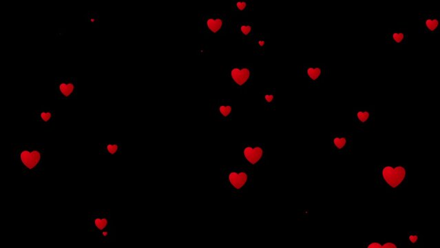 Red heart flying in cinematic slow motion on a black transparent background. Valentine's Day heart background.