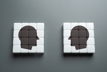 Two heads turned to each other, individuals. Intellectual duel. Competition of ideas, knowledge, or...