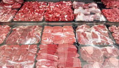 choosing pork, beef and other meats at the grocery store