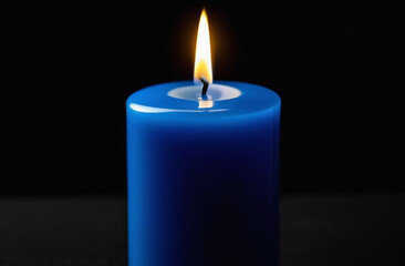 Blue candle on a black background.