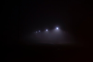 street lamps on misty night