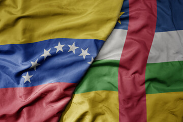 big waving national colorful flag of central african republic and national flag of venezuela . macro