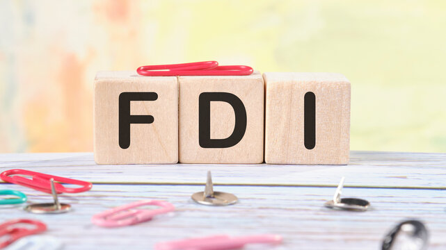 Word FDI written on wooden cubes stock image