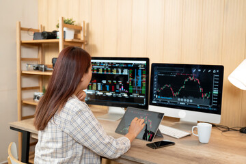 Side view businesswoman analyzing stock market investment with digital tablet. - 726436314
