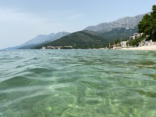 Clear water in Adriatic sea, visible mountains in Croatia