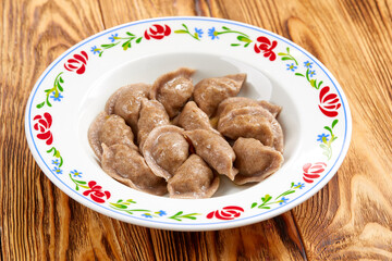 dumplings with meat on the wooden table