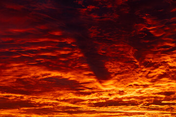 Orange and red clouds at sunrise or sunset.