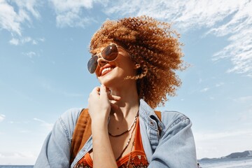 Beach Bliss: A Smiling Woman with a Backpack, Embracing Travel and Happy Vibes, Donning Sunglasses,...
