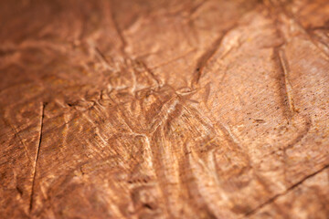 Extreme closeup of crumpled brass foil texture