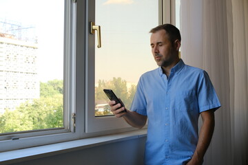 Office worker typing on smartphone