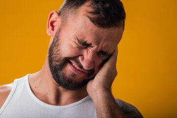 Obraz premium Man suffering from ear pain. Hand on ear. People, healthcare and medicine concept