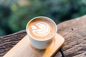 beautiful Latte art coffee with hot milk