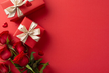 Fancy gift ensemble for her: Top view of plush roses, trendy gift parcels, hearts, and sparkle on a red field, with an empty area for inscription or promotion