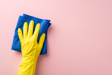 Ideal for housekeeping tasks, this image showcases a hand in a rubber glove, effortlessly wiping...