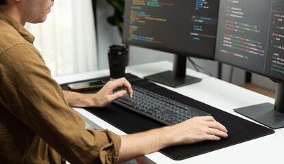 Working IT developer with stressful overworked in creating online software development coding on pc...