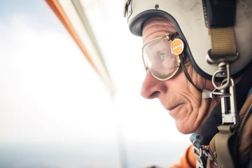 Fototapeten senior skydiver checking altimeter midair during descent © primopiano